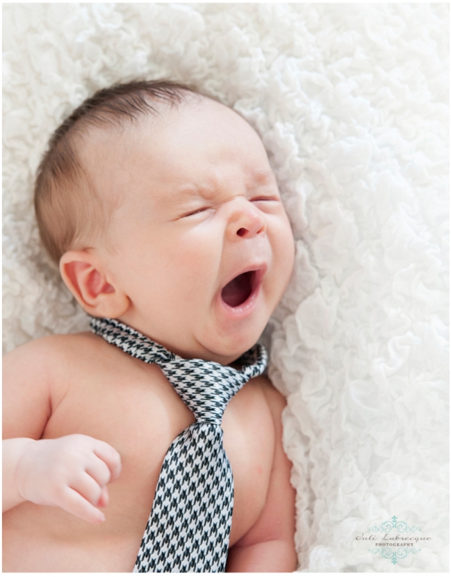 Baby wearing a neck tie