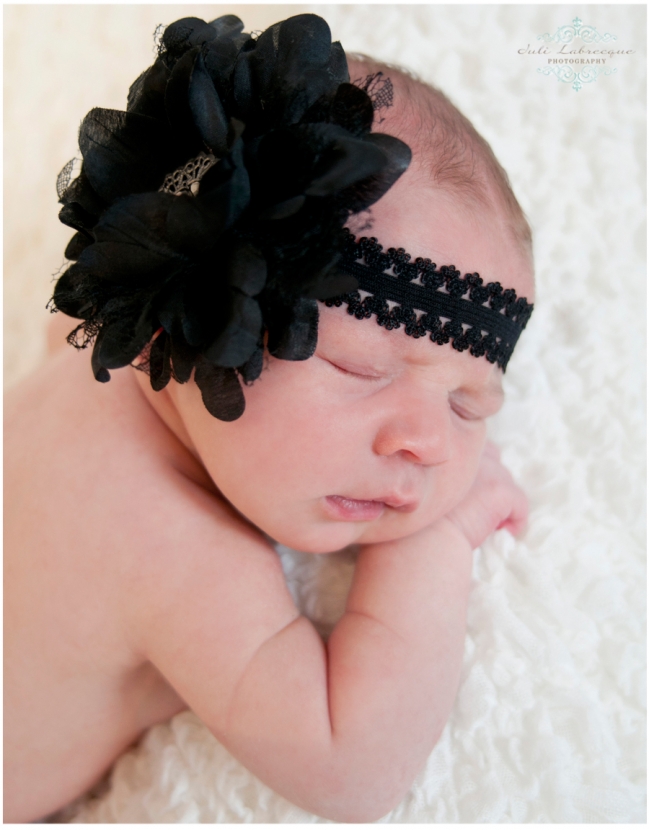 newborn with black headband