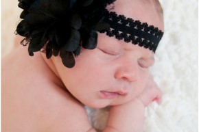 newborn with black headband