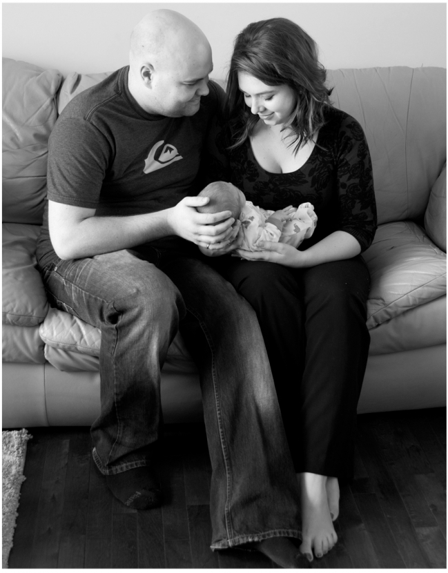 couple holding baby